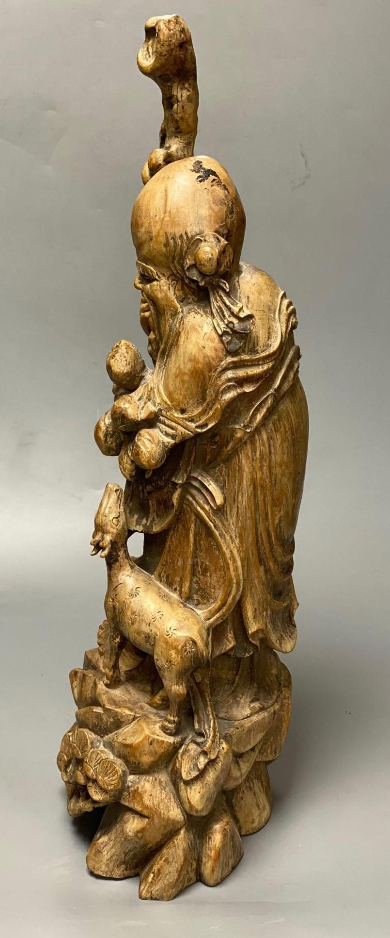 A Chinese carved hardwood figure of Shou Lao, 53cm